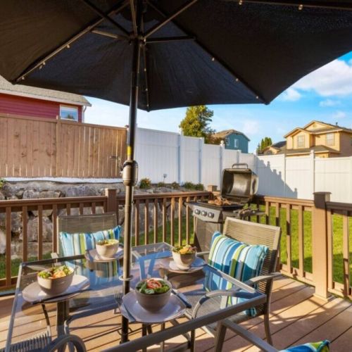 Step outside and immerse yourself in the inviting outdoor space of this deck, complete with comfortable tables and chairs.