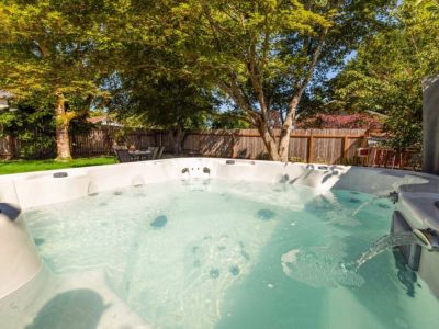 Hot tub view of the spacious backyard