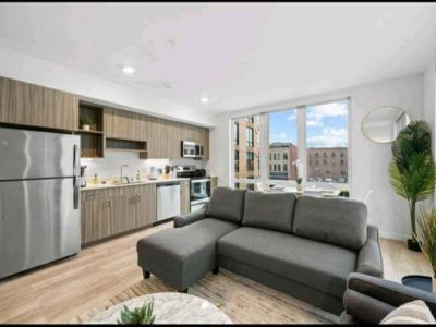 Cozy open concept living space with living, dining, and kitchen.