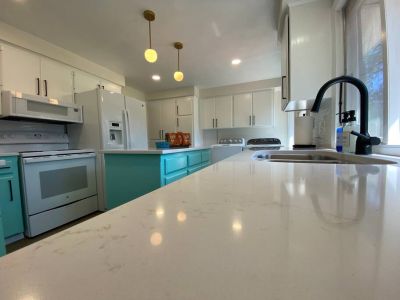 Newly remodeled Kitchen (2024) with quartz countertops, deep double stainless sink, and kitchen island.