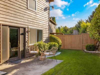 Relax, unwind, and savor the beauty of nature as you gather around this lovely coffee table with loved ones, creating lasting memories in the comfort of this backyard.