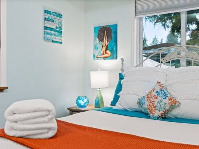 The tastefully designed room boasts ample space, inviting you to unwind and relax in style. This queen bedroom offers a tranquil retreat for a restful night's sleep.