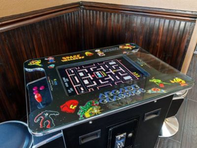 Gather around the 60 arcade cocktail table and let the fun begin! This nostalgic and entertaining centerpiece offers a wide selection of classic arcade games, providing hours of enjoyment for all ages