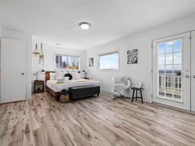 King En Suite Bedroom with private balcony. Soak in the sunset next to the elongated firepit.
