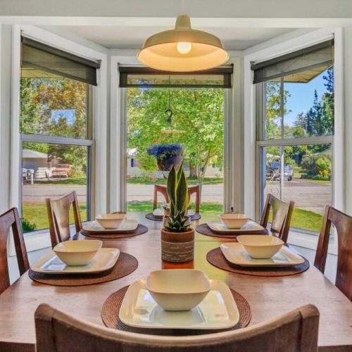 The beauty of our natural light dining area, where sunshine pours in through large windows, illuminating the space with a warm and inviting glow.