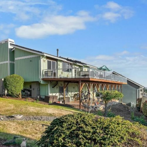 Waterview Haven has an upper deck and a lower covered patio, both with water views, and is currently unfenced.