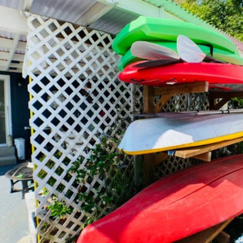 Explore the shoreline via adult and child sized kayaks and paddleboards. An assortment of life jackets are available in the chest located on the covered patio.
