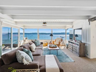 Step into a breathtaking living room that seamlessly blends the comforts of home with the awe-inspiring beauty of nature.