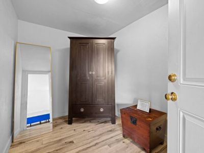 Large walk-in closet has room to store all of your travel accessories.