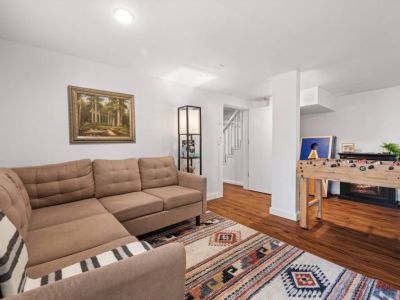 Welcome to our inviting lower-level family and game room, a haven for relaxation and entertainment. This versatile room provides endless opportunities for fun and relaxation.