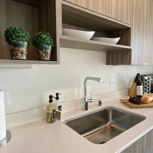 The luxury design includes quartz countertops throughout.