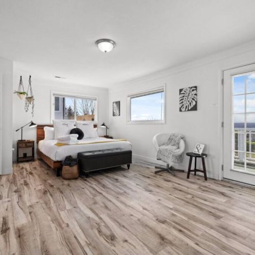 King En Suite Bedroom with private balcony. Soak in the sunset next to the elongated firepit.