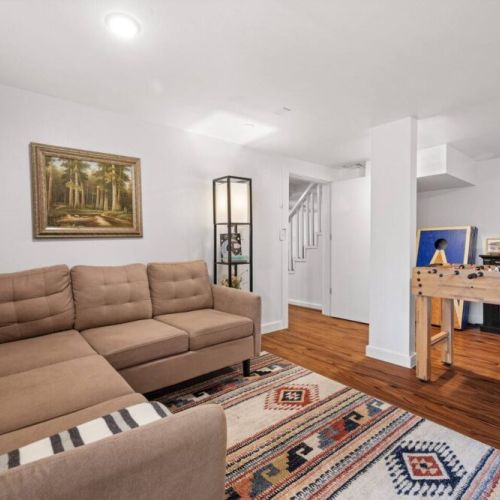 Welcome to our inviting lower-level family and game room, a haven for relaxation and entertainment. This versatile room provides endless opportunities for fun and relaxation.