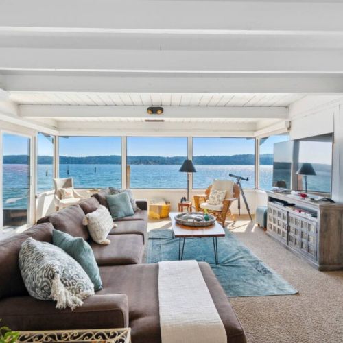 Step into a breathtaking living room that seamlessly blends the comforts of home with the awe-inspiring beauty of nature.