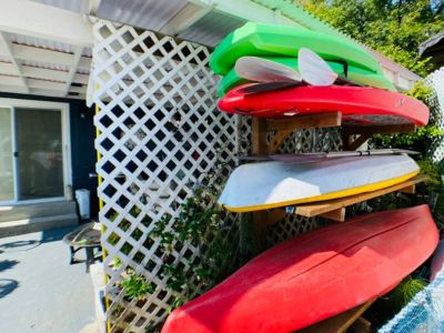 Explore the shoreline via adult and child sized kayaks and paddleboards. An assortment of life jackets are available in the chest located on the covered patio.