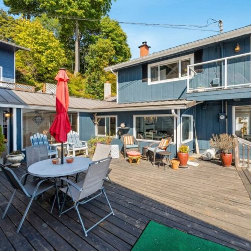 Surrounded by the gentle sound of waves providing a serene and tranquil atmosphere on this open aired deck.