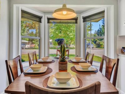 The beauty of our natural light dining area, where sunshine pours in through large windows, illuminating the space with a warm and inviting glow.