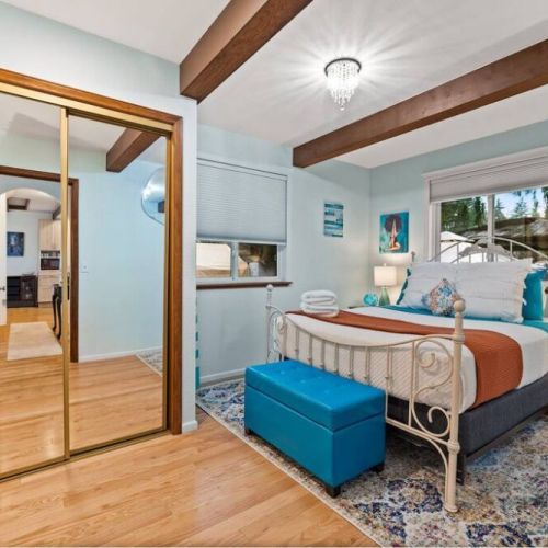 Settle in luxurious comfort in this spacious queen bedroom, conveniently located on the main floor for easy accessibility and convenience.