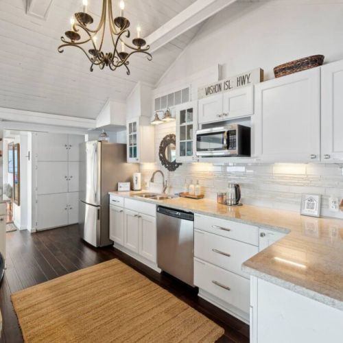 This pristine space is a minimalist's dream, with sleek lines and a bright, airy ambiance that creates an atmosphere of sophistication and functionality.