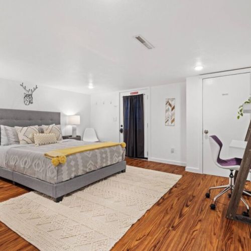 Venture downstairs to the spacious  basement where this large Queen bedroom awaits.