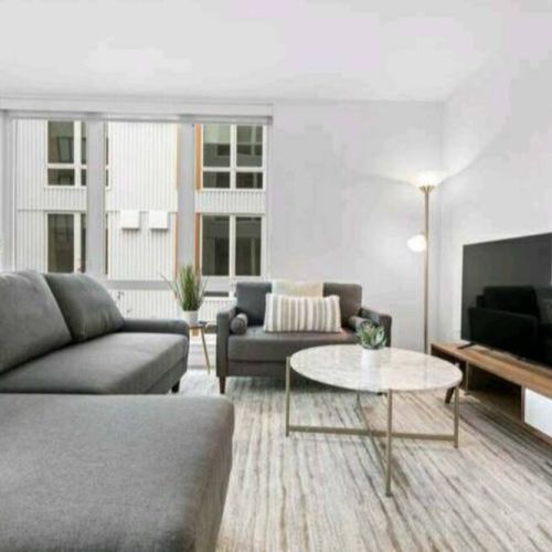 Positioned perfectly in the room, the TV becomes a portal to endless entertainment, casting a warm glow that transforms the space into a haven for cinematic experiences and cozy evenings.