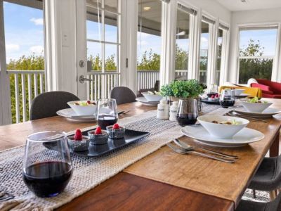 Stunning dining tale overlooks a breathtaking view. The perfect setting to savor culinary delights while enjoying the beauty of nature.