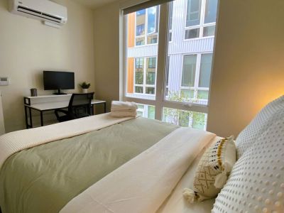 Tall windows provide natural light with full black out shades for privacy.