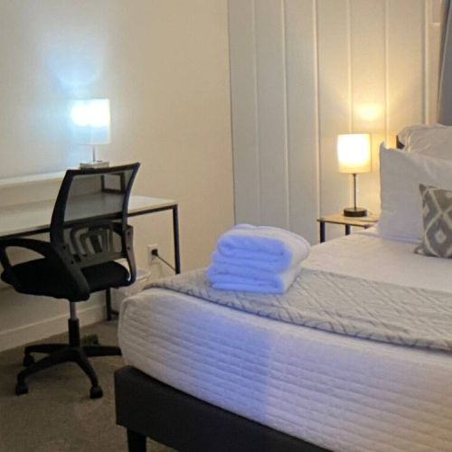 Full size bed with a full size office desk and ergonomic chair ensures comfort whether working or sleeping.