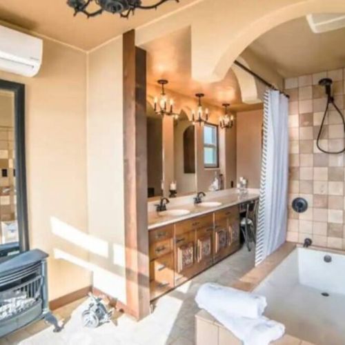 Soak in the deep elongated bathtub while being warmed by the ventless gas fireplace and taking in the water view from the King En Suite Bathroom