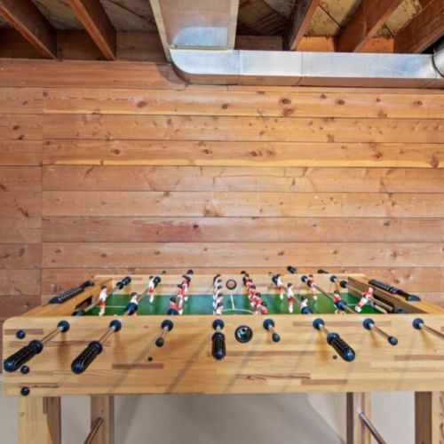 The lower level game room is a big hit for adults and kids  alike. It is shared with the laundry room.