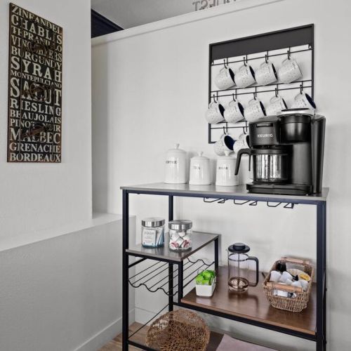 A thoughtfully arranged complimentary tea and coffee station awaits, offering a delightful selection of hot beverages to be enjoyed at any time.