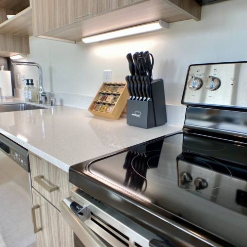 Quartz countertops have plenty of under-cabinet lighting and space to create culinary delights.