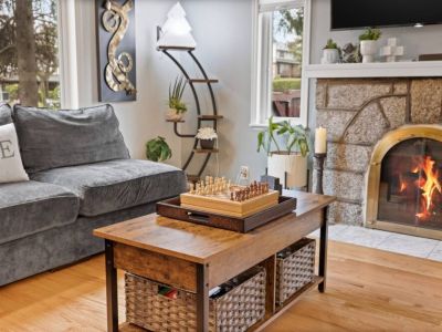 Curl up on the plush sofa, savoring a hot cup of cocoa or a good book next to this inviting ambiance of our cozy gas fireplace.