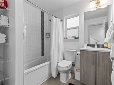 Main Floor Full Bathroom: Shower/Tub, Bidet, with shelves for your personal items