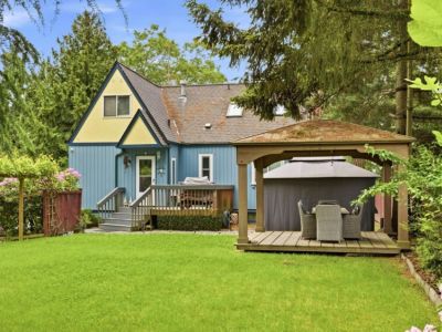 A spacious manicured backyard is perfect for playing and relaxing.