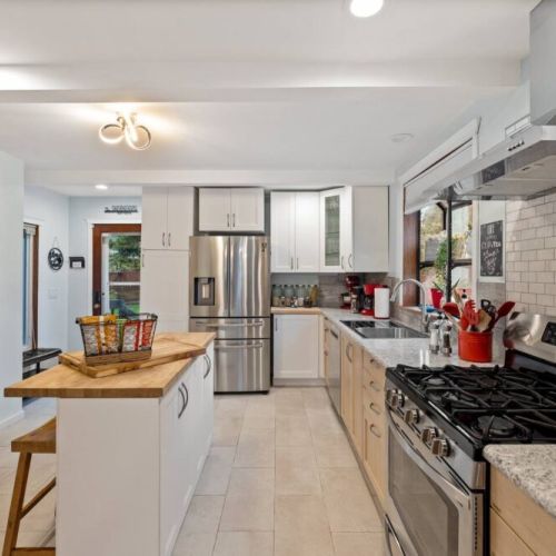 Our brightly lit gourmet kitchen is a culinary haven where every detail is designed to elevate your cooking experience.