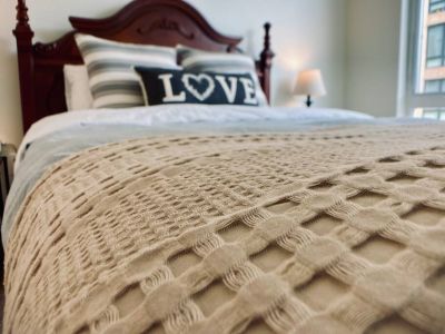 Each queen bedroom has additional standard pillows and an extra blanket at the foot of the bed.