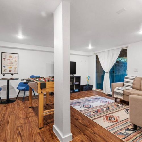 This spacious and comfortable area offers a variety of activities and games for everyone to enjoy. Whether you're watching movies, playing games, or simply lounging,