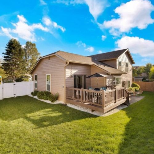 Enjoy privacy and peace of mind in this inviting fenced backyard, creating a secure and tranquil space for relaxation and play.