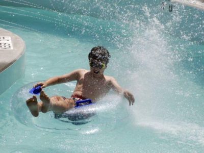 Park swimming pool includes a lazy river feature.