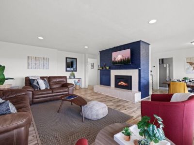 A spacious living area invite families to gather and create lasting memories together. The open layout provides ample space for shared activities and lively board game sessions.