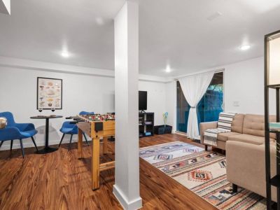 This spacious and comfortable area offers a variety of activities and games for everyone to enjoy. Whether you're watching movies, playing games, or simply lounging,