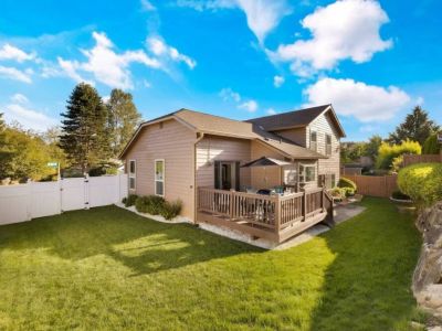 Enjoy privacy and peace of mind in this inviting fenced backyard, creating a secure and tranquil space for relaxation and play.