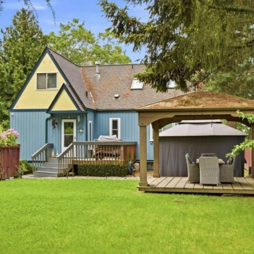 A spacious manicured backyard is perfect for playing and relaxing.