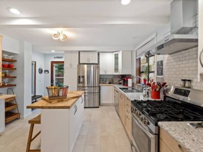 Our brightly lit gourmet kitchen is a culinary haven where every detail is designed to elevate your cooking experience.