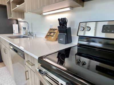 Quartz countertops have plenty of under-cabinet lighting and space to create culinary delights.