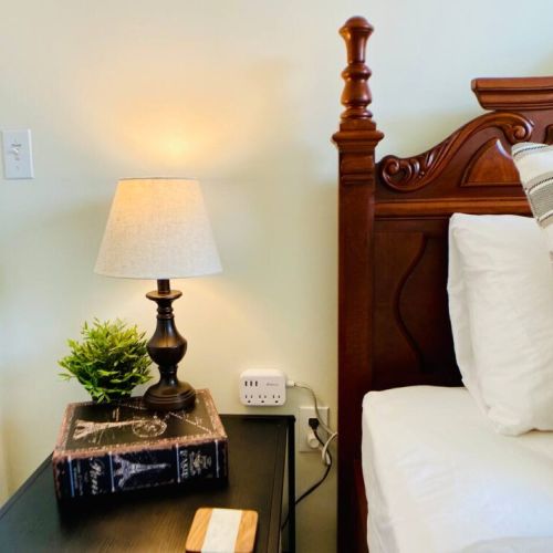 This queen bedroom has a multiple option charging station at each night stand and a white noise machine. zZzz