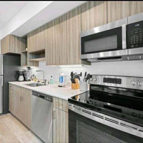 Designed with meticulous attention to both style and functionality, this kitchen is a canvas of modern elegance, where sleek surfaces and intuitive organization seamlessly blend into a space that inspires culinary creativity.