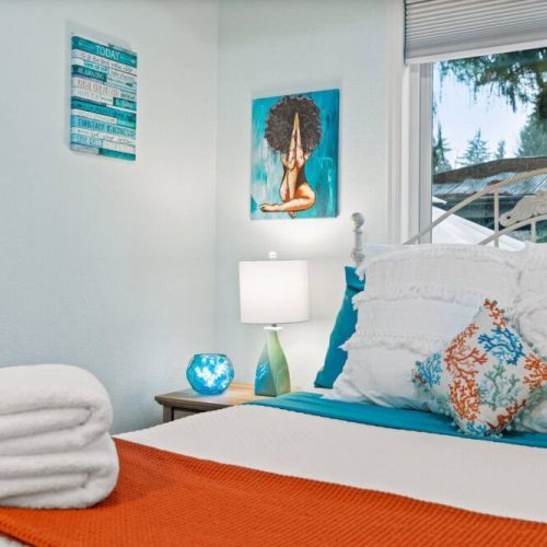 The tastefully designed room boasts ample space, inviting you to unwind and relax in style. This queen bedroom offers a tranquil retreat for a restful night's sleep.