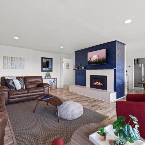 A spacious living area invite families to gather and create lasting memories together. The open layout provides ample space for shared activities and lively board game sessions.